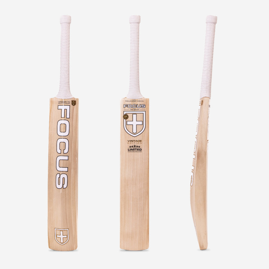 A premium-grade cricket bat from Focus, displayed from three different angles – front, back, and side view. The bat features a light-colored willow blade with a sleek design, bold focus cricket branding